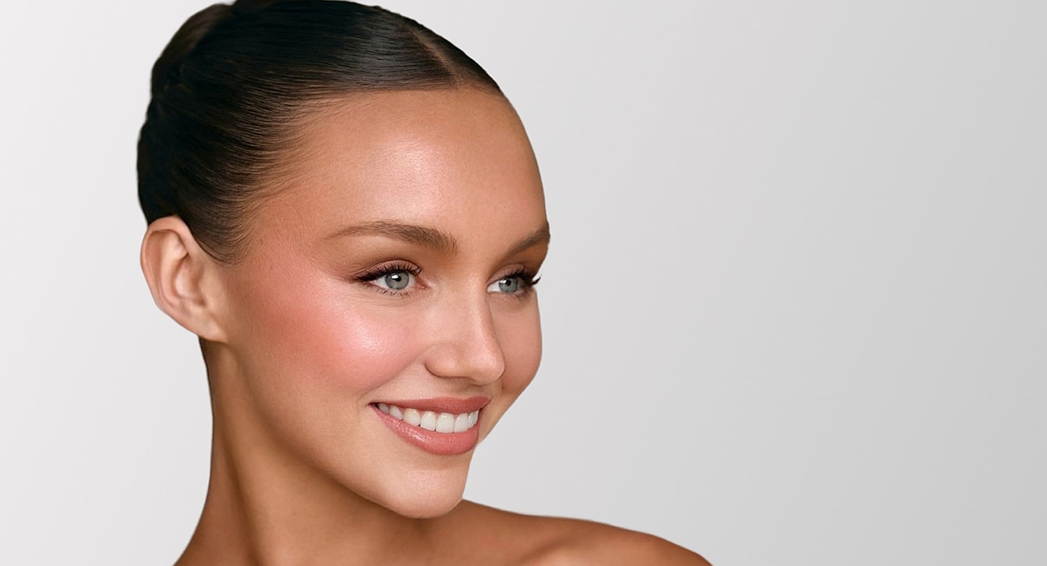 Beverly Hills plastic surgery model with elegant hairstyle and makeup.
